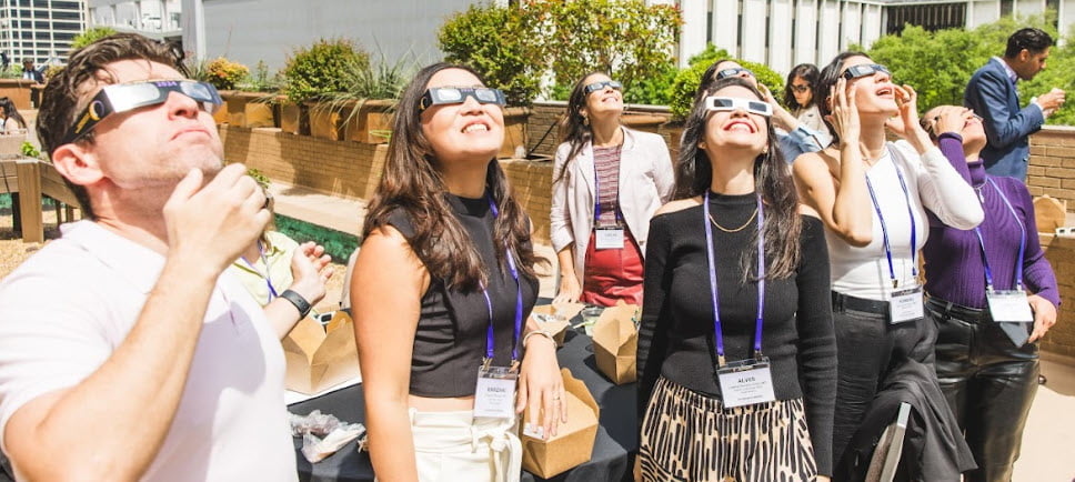 attendees watching eclipse